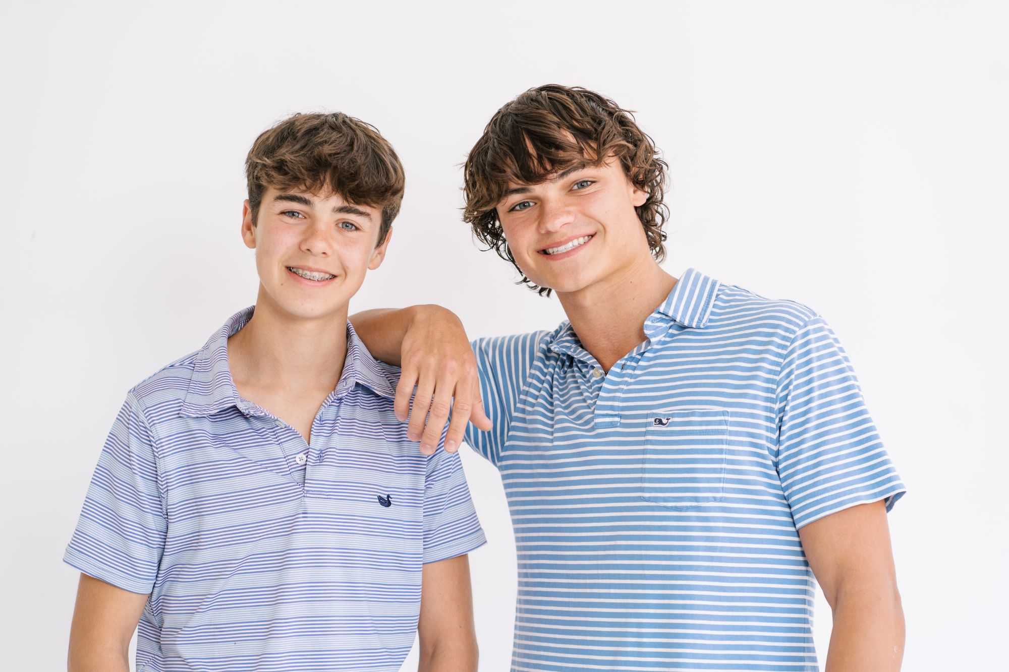 Two smiling teen patients of Dr. Ryan Cox at Ryan Cox Orthodontics, a trusted orthodontist for Calhoun, GA families